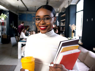 woman educator and leader holding books
