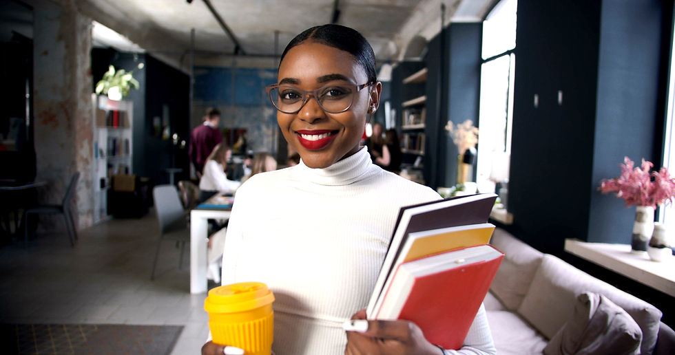 woman educator and leader holding books