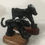 Thumbnail: Two black panther sculptures on wooden bases