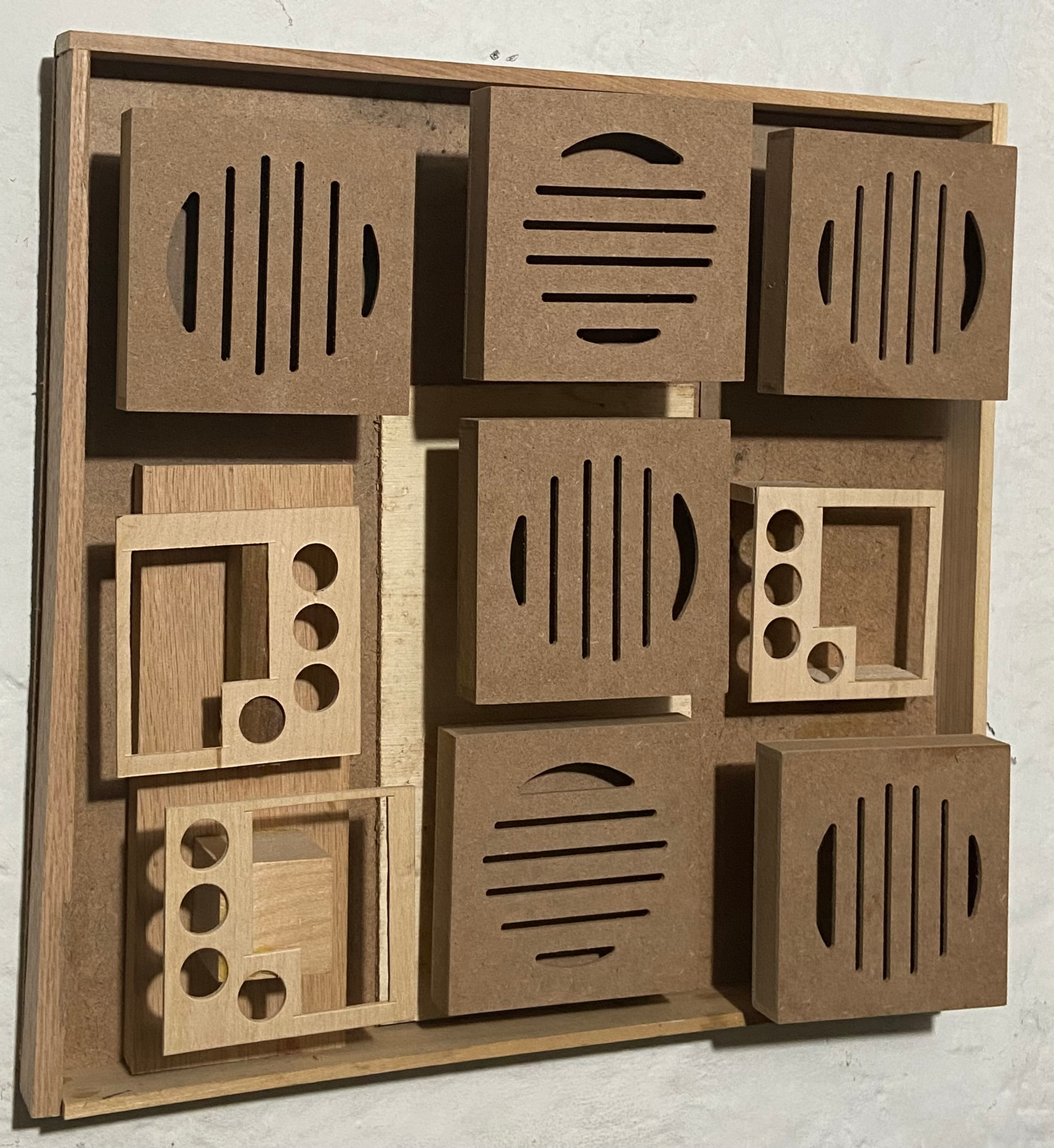 Wooden puzzle with geometric cutouts