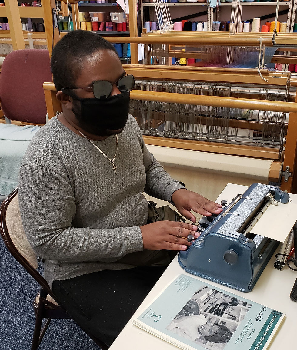 Derrick writing at the Brailler