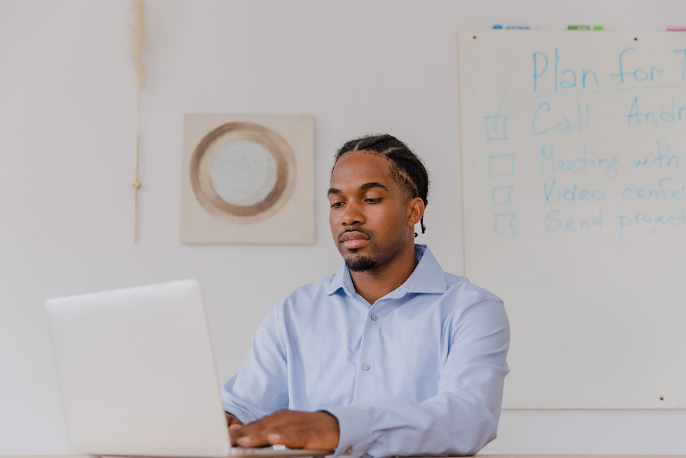 Business owner taking a cyber insurance readiness quiz on his laptop