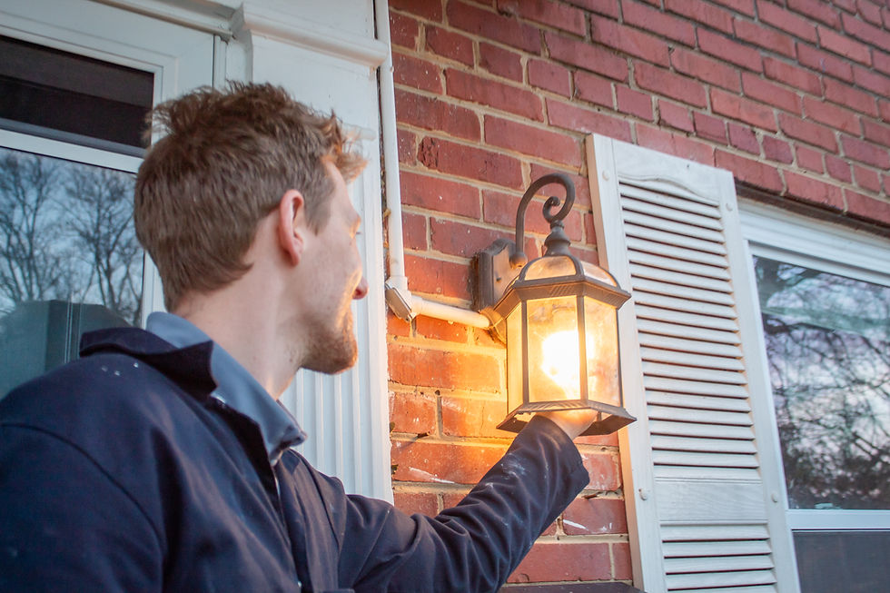 A handyman change a light bulb