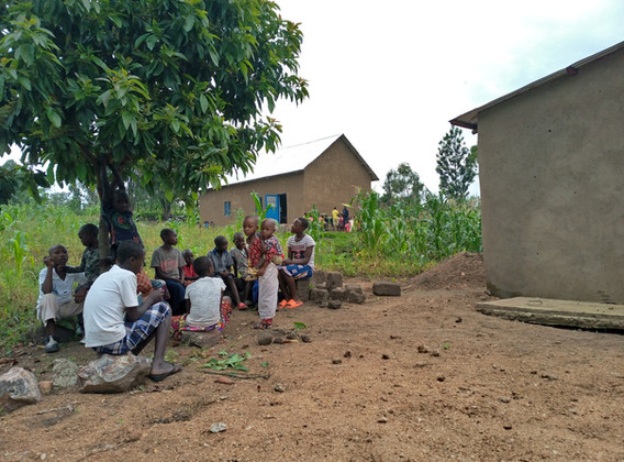 60eca173b23987256b264e8b_13. Young children are equiped (You can see the behide the church