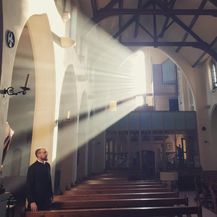 sunlit church and Fr.jpg