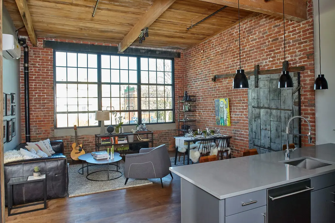 Open living room with exposed brick and large industrial windows – 11 Chestnut street, SoNo, CT