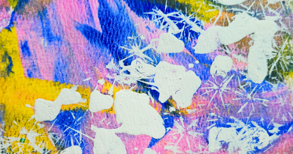 Abstract painting with splashes of white over vivid pink, yellow, and blue brushstrokes. The textured canvas creates a dynamic feel.