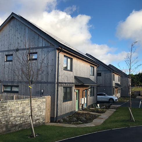 Innovative, affordable housing development with communal spaces and eco-materials_