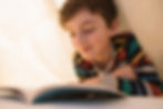 kid_reading_undercovers.jpeg