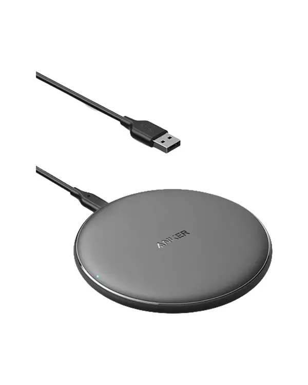 Anker 313 wireless charging pad with compact circular design and USB power cable for Qi-enabled devices.