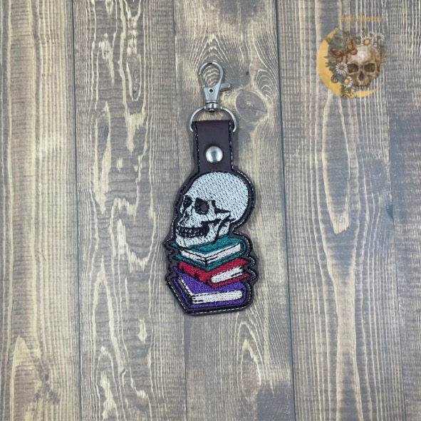 Skull with book stack keyfob