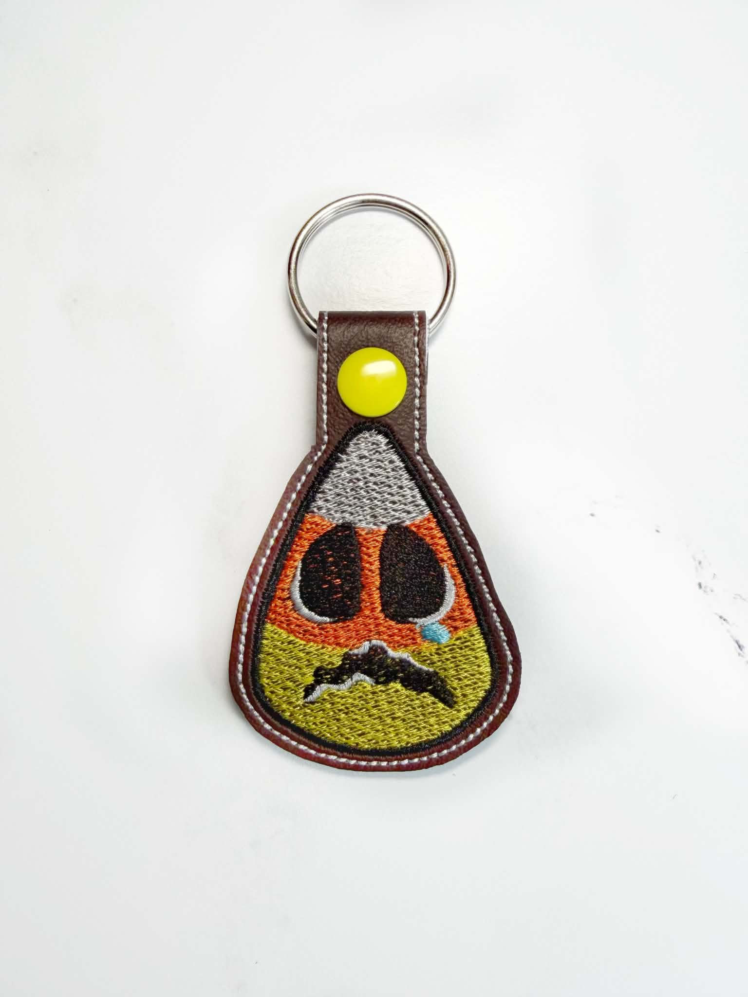Sketchy sad candy corn keychain