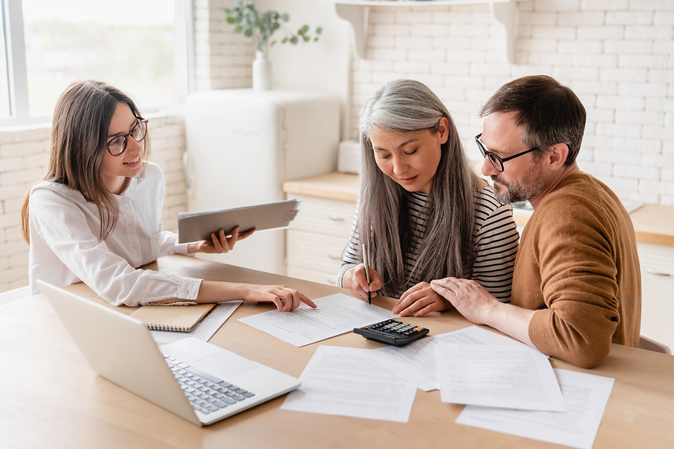 Insurance agent consulting mature family couple, discussing health insurance, signing cont