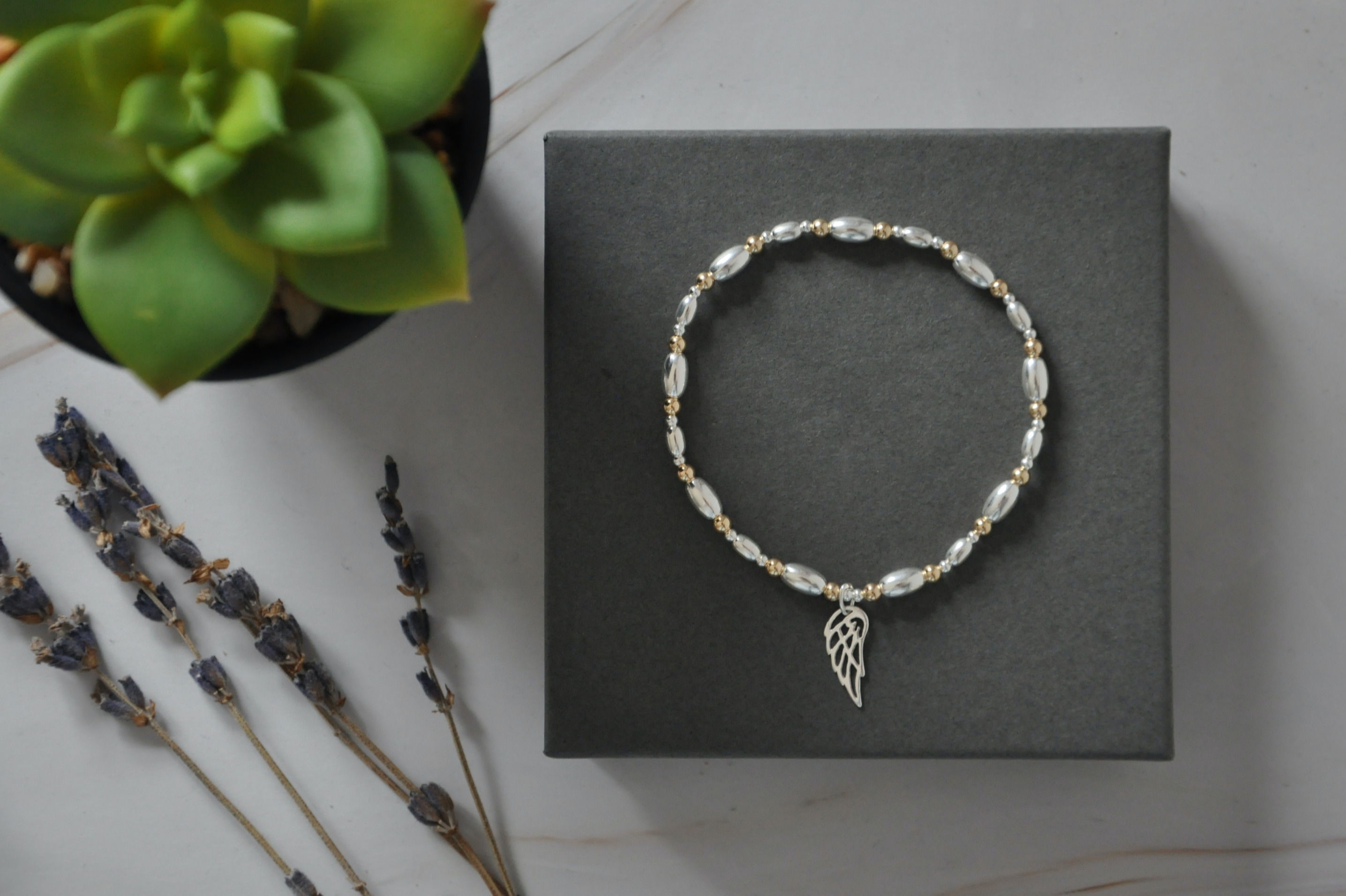 Angel Wing Charm Bracelet in A Touch of Gold