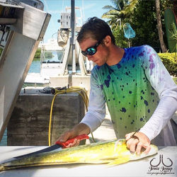 The perfect attire for catching some dolphin. Check out our shirts online. Including this one. Photo