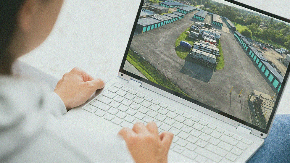 a person viewing a photo of a storage facility in a laptop