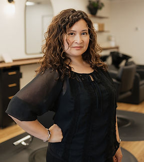 Hair Stylist Lorraine standing and smiling