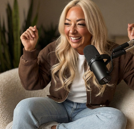 Claire Sinclair sitting in a relaxed home setting for her manifestation coaching brand