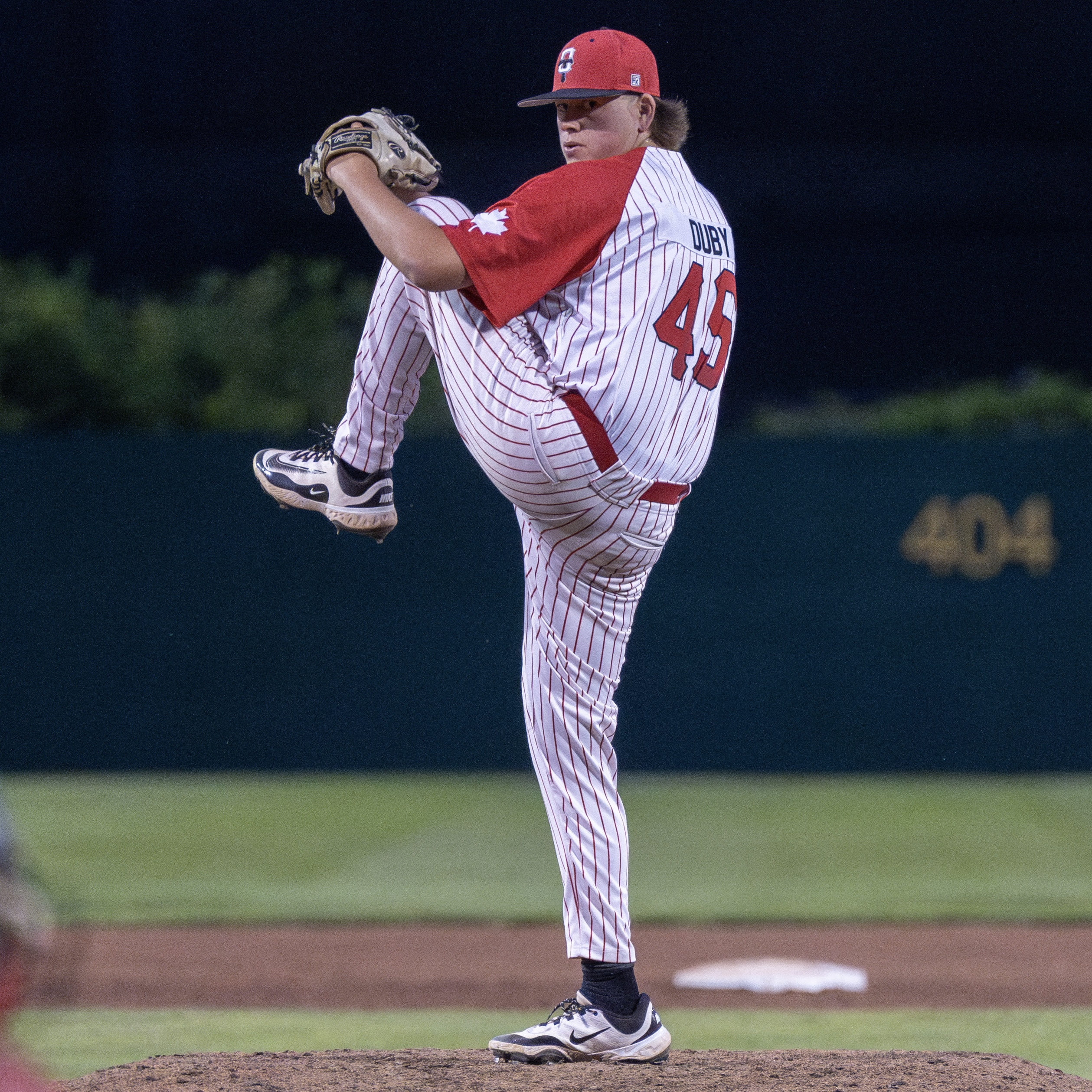 Coach Duby pitching in professional baseball