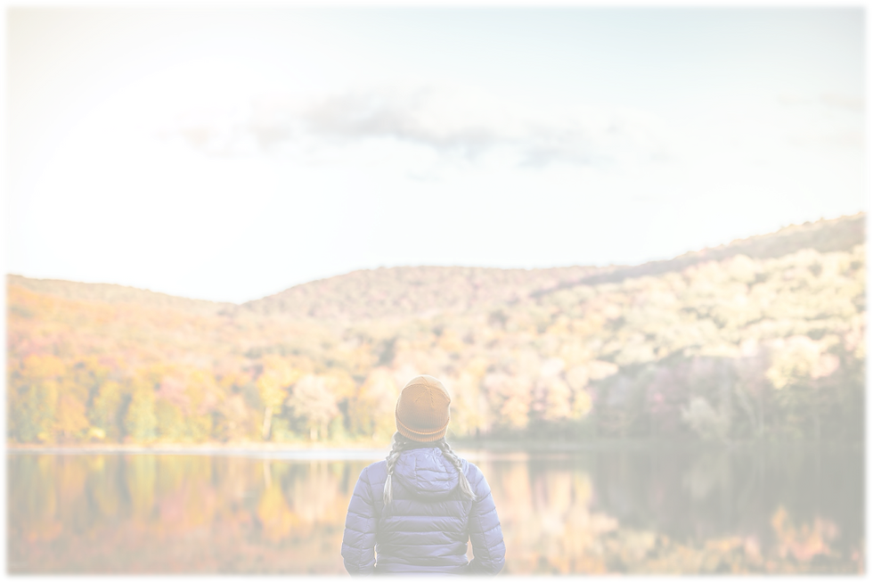 Looking over a lake with colorful leaves in Autumn.