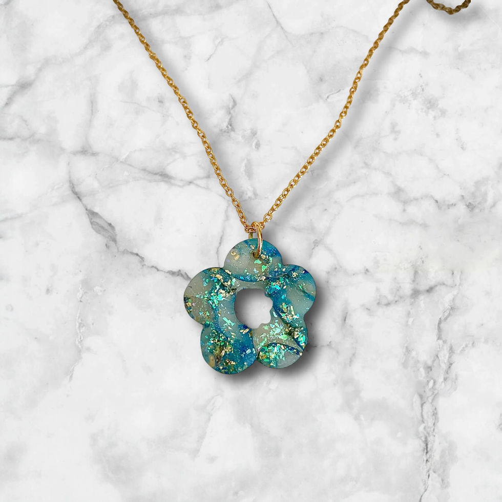 Flower necklace on a gold flower necklace chain.