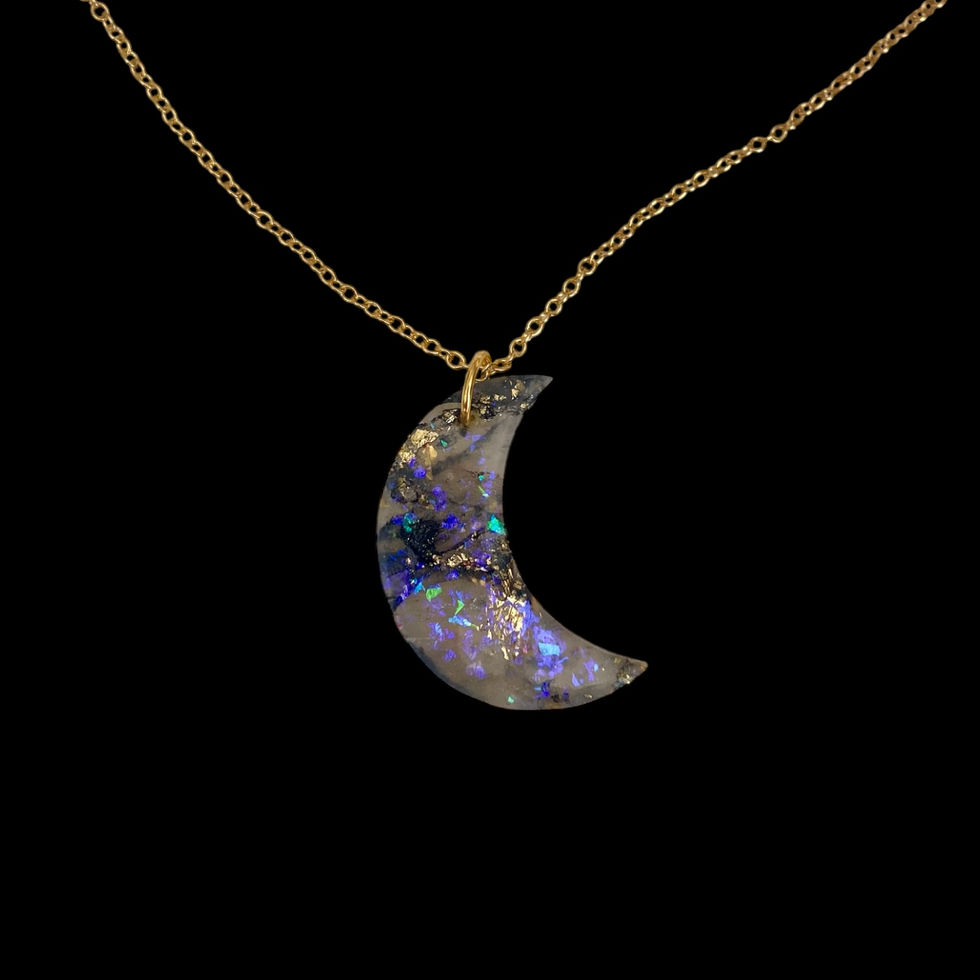 A moon necklace on a gold moon necklace chain for celestial style.