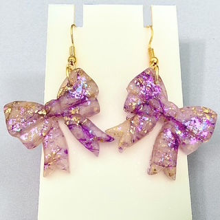 Bow earrings and gold bow earrings for a whimsical look.