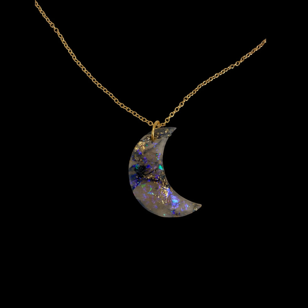 A moon necklace on a gold moon necklace chain for celestial style.