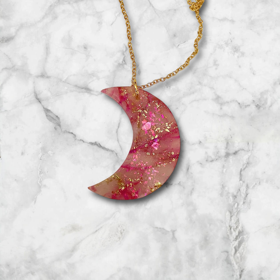 Moon necklace on a gold moon necklace chain.