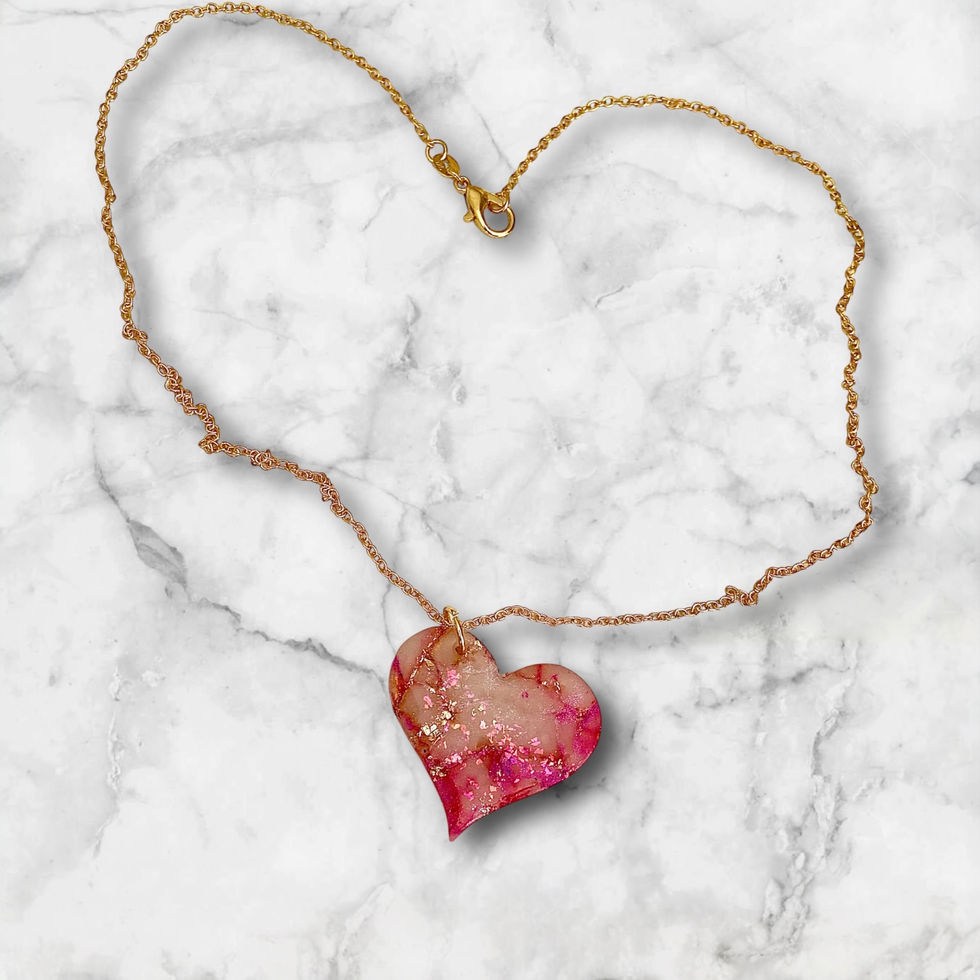 A heart necklace with a gold heart necklace chain for a romantic style.