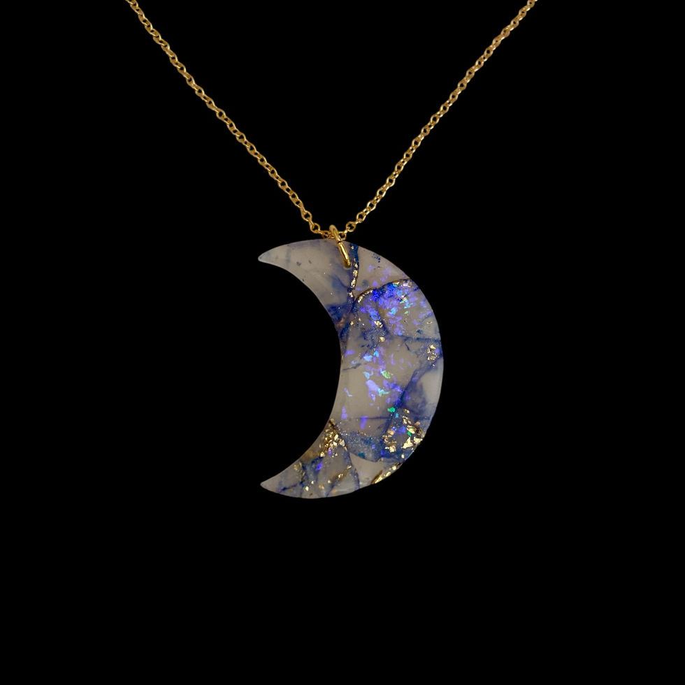 A moon necklace on a gold moon necklace chain for celestial style.