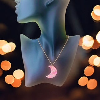 Moon necklace on a gold moon necklace chain.