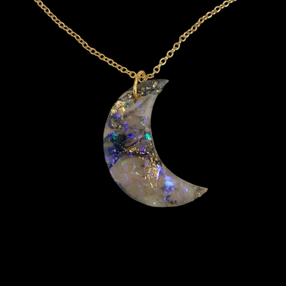 A moon necklace on a gold moon necklace chain for celestial style.