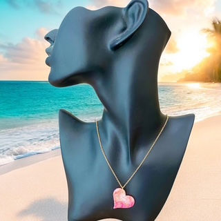 A heart necklace with a gold heart necklace chain for a romantic style.