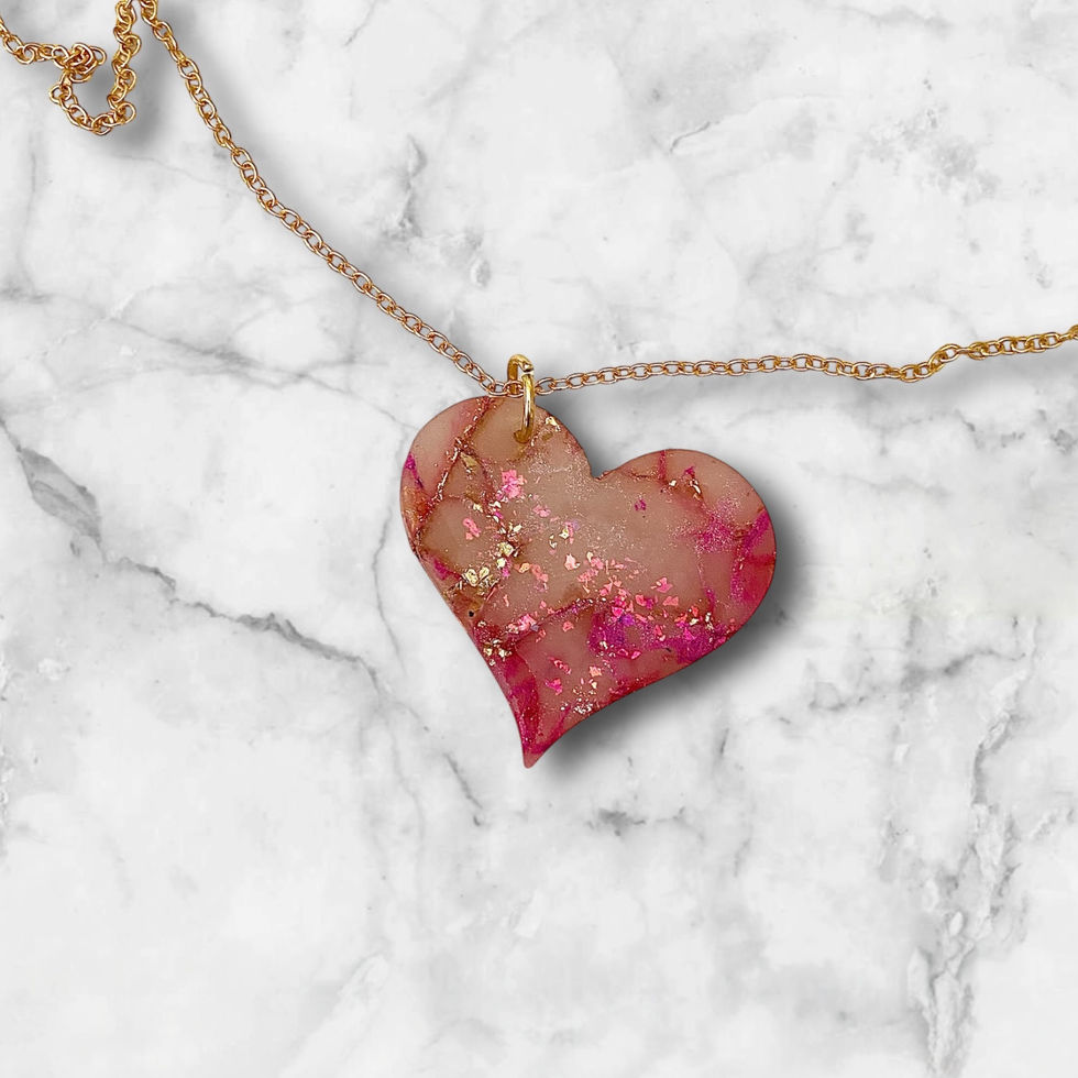 A heart necklace with a gold heart necklace chain for a romantic style.