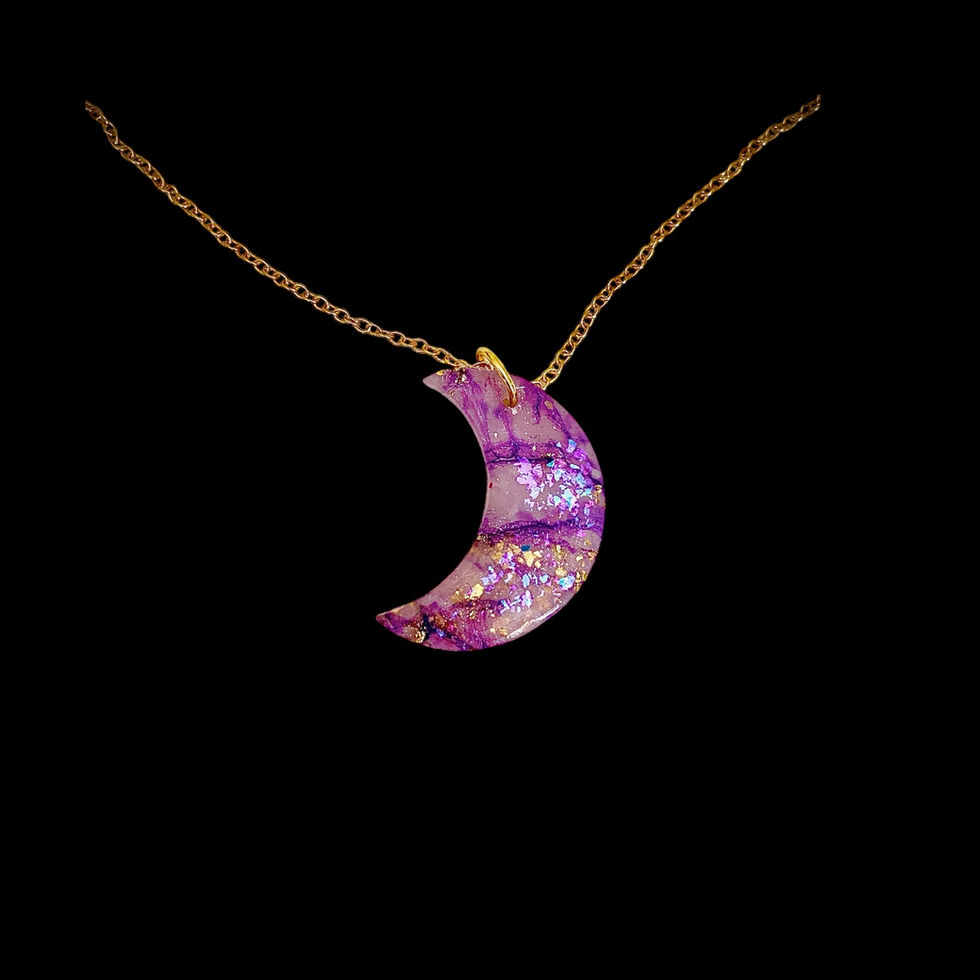 Moon necklace on a gold moon necklace chain.