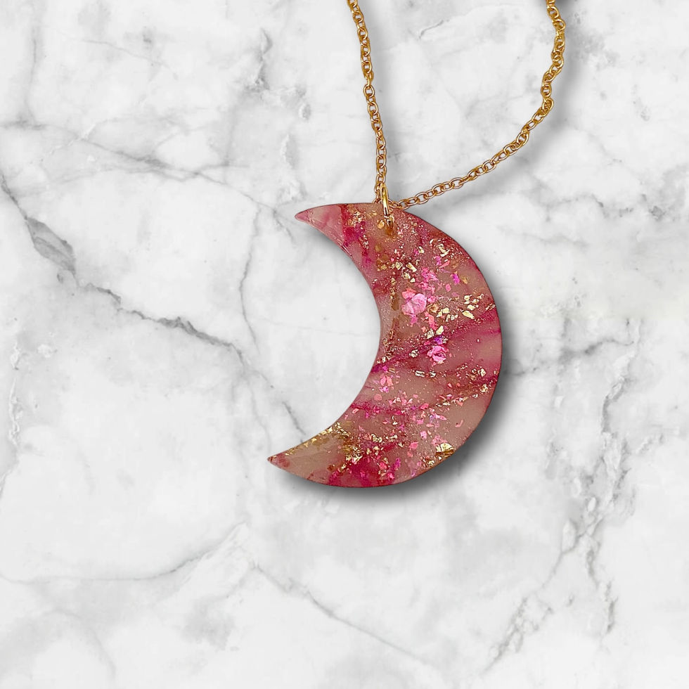 Moon necklace on a gold moon necklace chain.