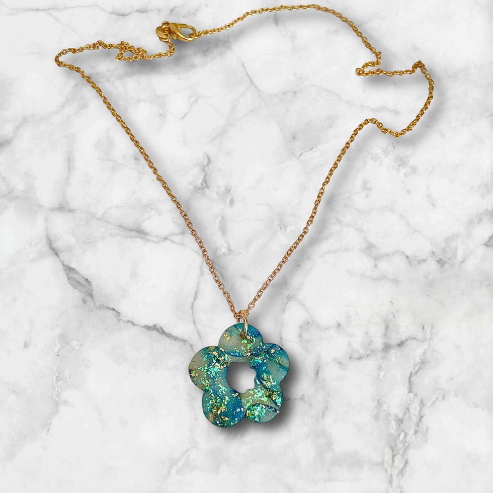 Flower necklace on a gold flower necklace chain.