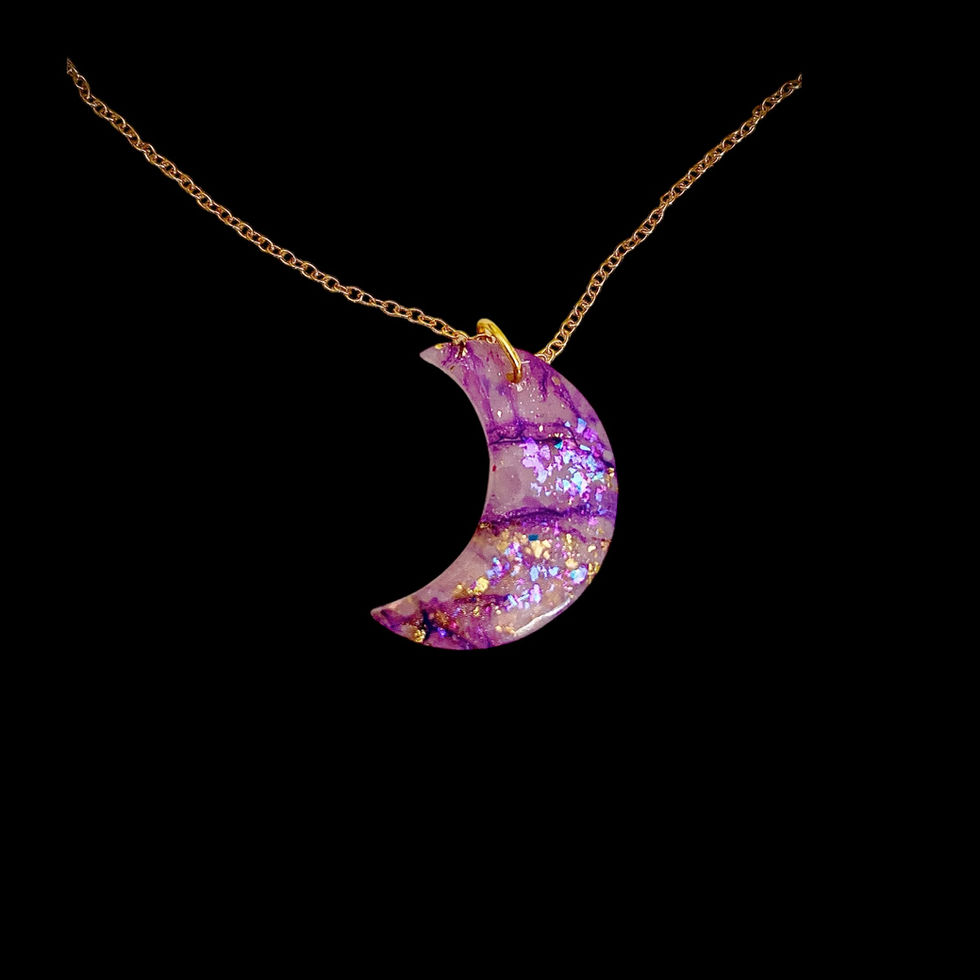 Moon necklace on a gold moon necklace chain.