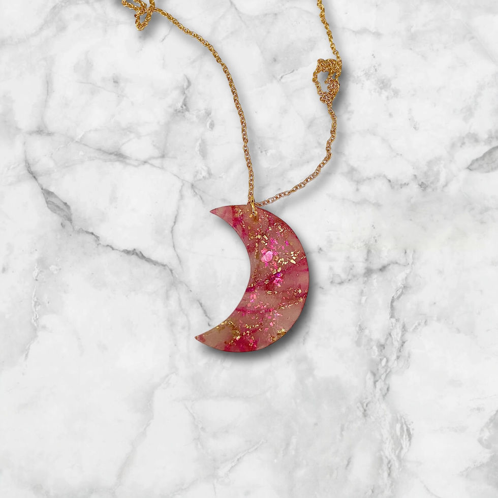 Moon necklace on a gold moon necklace chain.