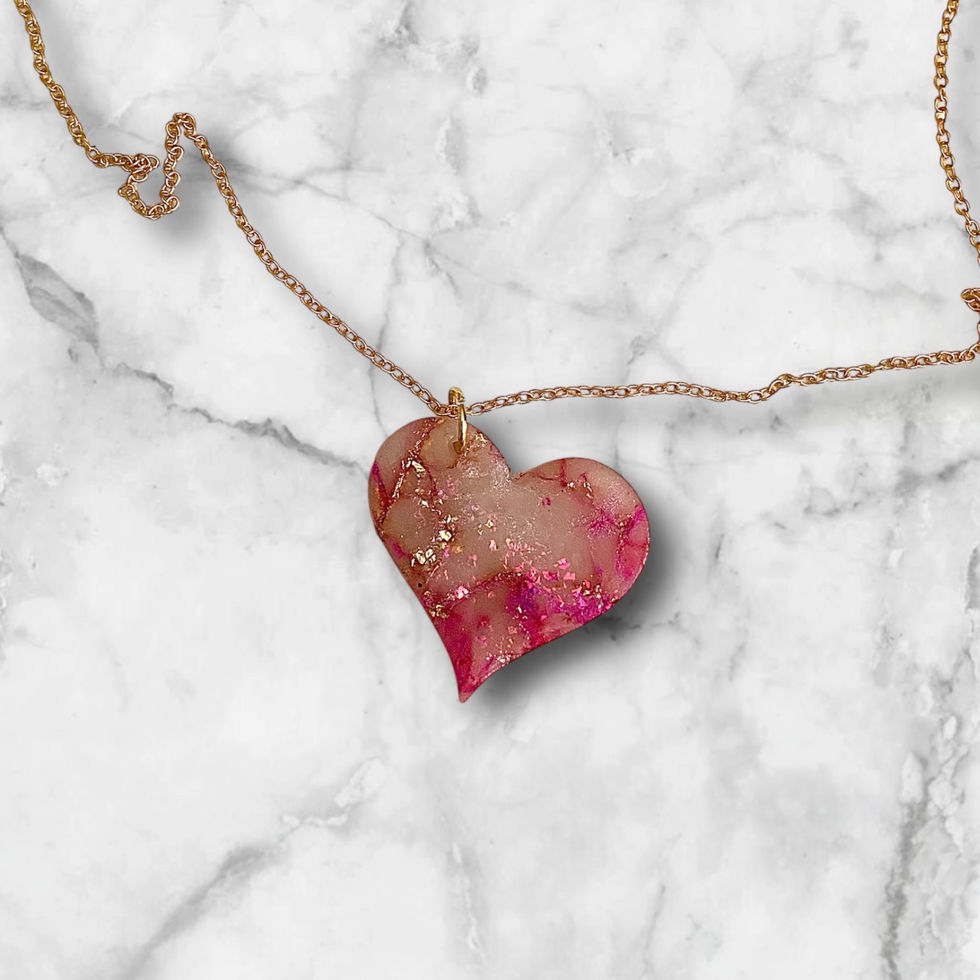 A heart necklace with a gold heart necklace chain for a romantic style.