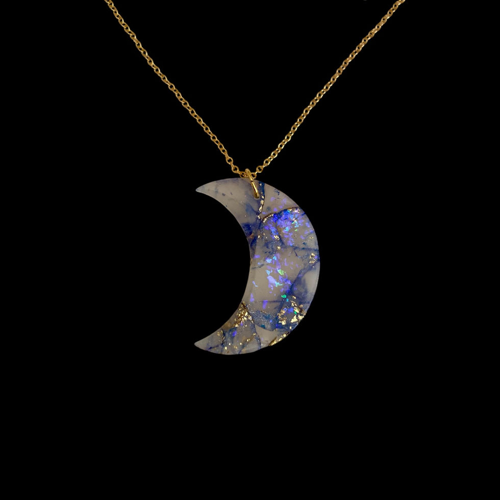 A moon necklace on a gold moon necklace chain for celestial style.