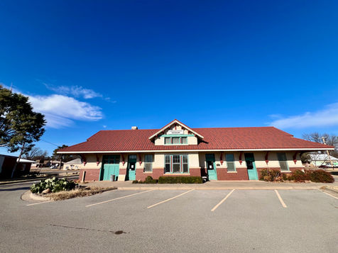 The exterior of the Shortgrass Country Museum, located in a historic brick railroad depot building in Sayre.