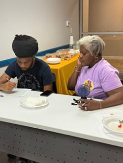 NGU mentor working one-on-one with a student at a tutoring session