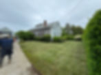 Fresh lawn installation and grading at coastal home in Dartmouth, Massachusetts by Breeze Landscape & Design.