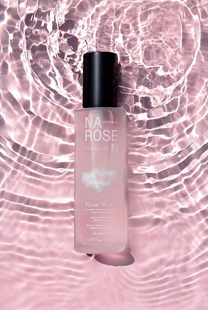 rose bottle on a pink background