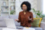 Woman on headset gives online presentation