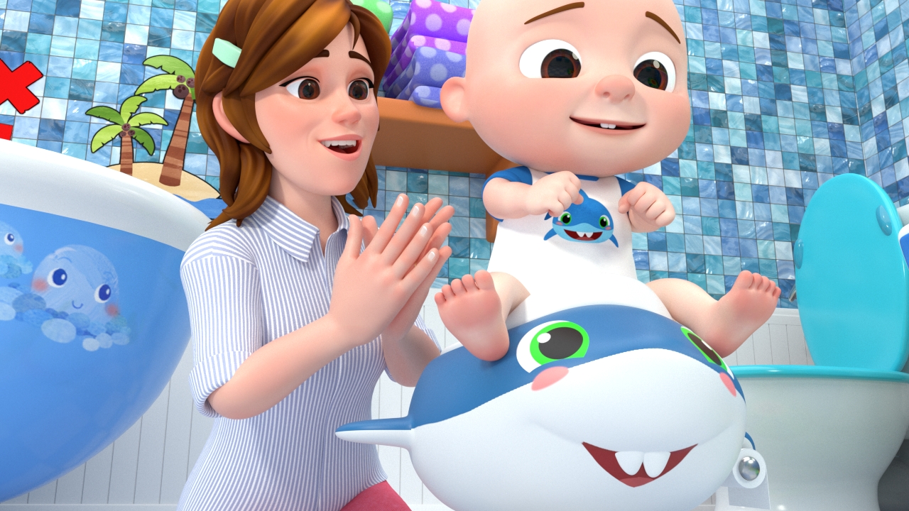 A mom claps for JJ sitting on a shark-shaped potty chair, part of CoComelon's 'Potty Training Song' episode.