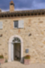 Traditional stone villa entrance with arched doorway at Poggio Posillipo