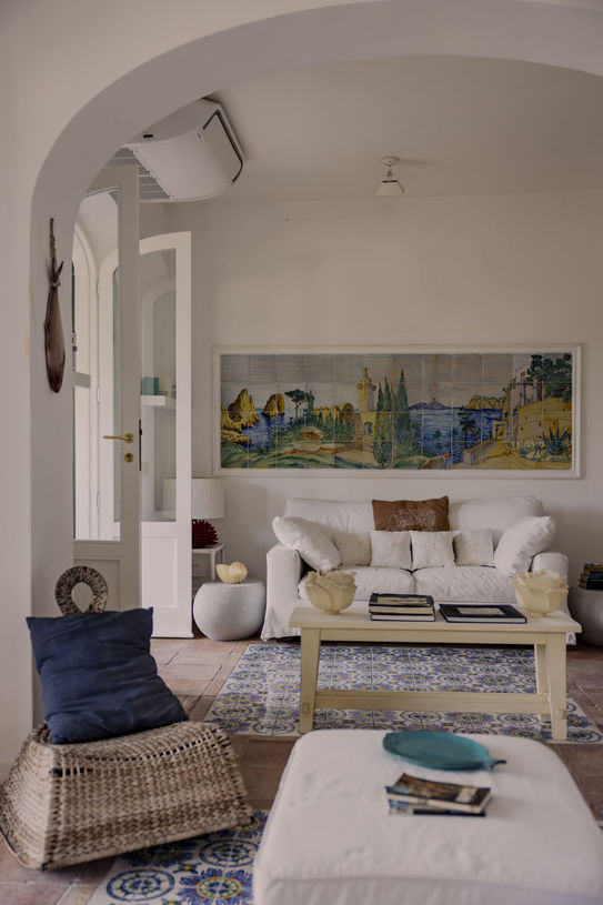 Poggio Posillipo Capri. Villa for rent. Interiors are handmade by a local artisans to Poggio Posillipo Capri villa design. The mosaic on the main wall dominates and observes all corners.
